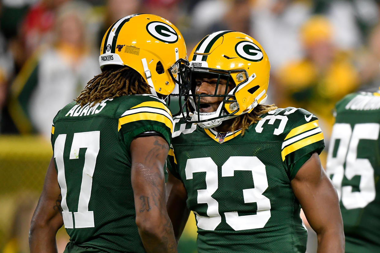 GREEN BAY, WISCONSIN - SEPTEMBER 26: Davante Adams #17 and Aaron Jones #33 of the Green Bay Packers celebrate against the Philadelphia Eagles at Lambeau Field on September 26, 2019 in Green Bay, Wisconsin. (Photo by Quinn Harris/Getty Images)