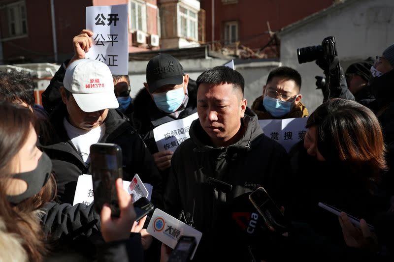 Family members of passengers on Malaysia Airlines flight MH370 that went missing in 2014, in Beijing