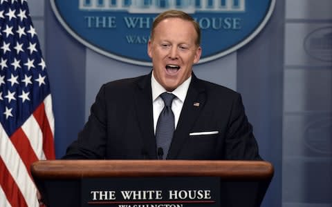 Sean Spicer, White House press secretary, laughs during a White House press briefing in Washington, D.C., U.S., on Tuesday, May 30, 2017 - Credit: Bloomberg