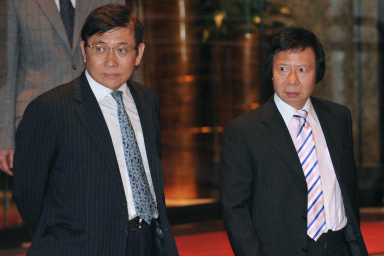 Chairmans and Managing Directors of Sun Hung Kai Properties Raymond Kwok (L) and Thomas Kwok in Hong Kong on April 3, 2012