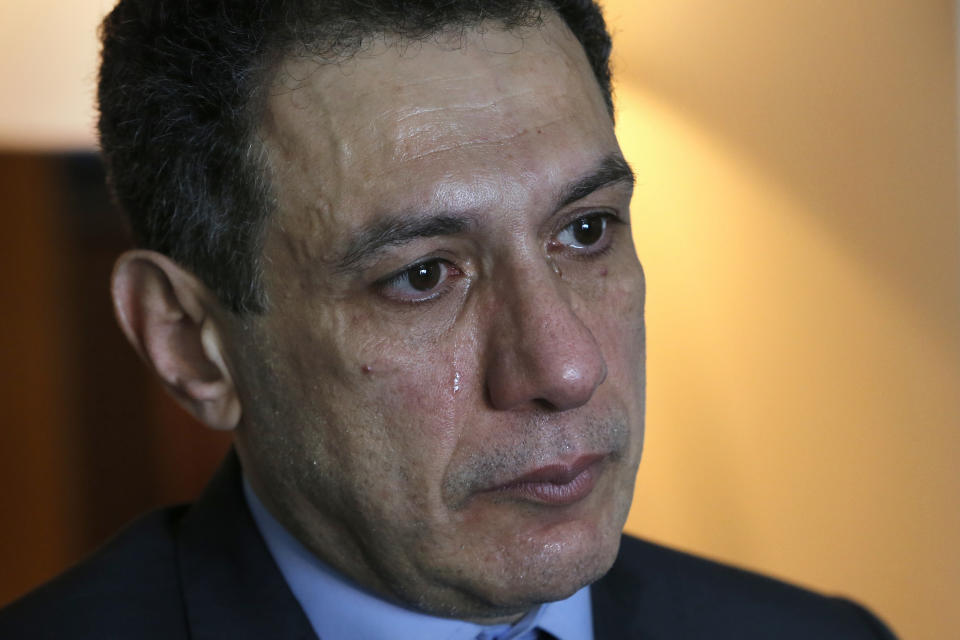 Nizar Zakka a Lebanese citizen and permanent U.S. resident who was released in Tehran after nearly four years in jail on charges of spying, cries during an interview with The Associated Press at a hotel in Dbayeh, north of Beirut, Lebanon, Wednesday, June 12, 2019. Zakka, an information technology expert, who was detained in Iran in September 2015 while trying to fly out of Tehran called on President Donald Trump to "get back your hostages" from Iran. He was sentenced to 10 years in prison after authorities accused him of being an American spy - allegations vigorously rejected by Zakka, his family and associates. (AP Photo/Bilal Hussein)