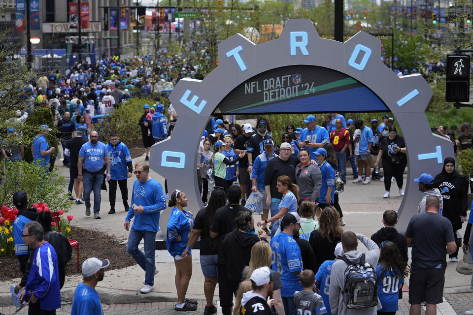 Fans attend the third day of the NFL football draft, Saturday, April 27, 2024, in Detroit. (AP Photo/Jeff Roberson)