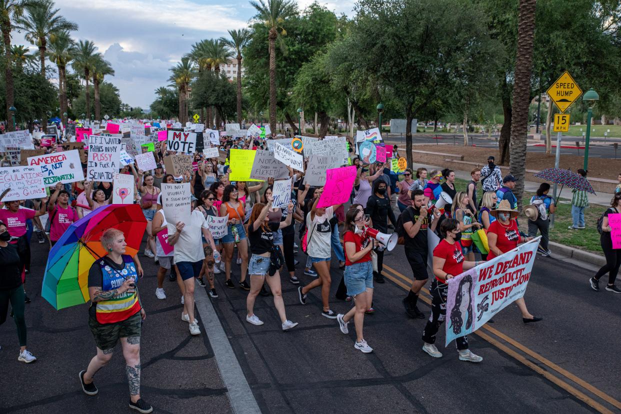 Thousands of people march outside the Arizona Capitol in Phoenix to protest the Supreme Court decision in Dobbs v. Jackson Women's Health Organization on June 24, 2022. The court's decision overturns the nearly 50-year-old Roe v. Wade ruling, which established the legal right to abortion in the country.