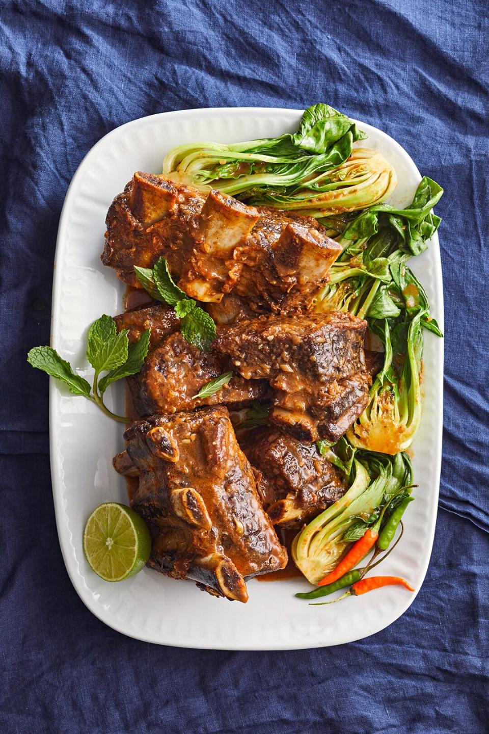 We know it's tough to wait while you braise short ribs, but the low-and-slow method produces the juiciest, tastiest results. Red curry and coconut milk gives this super tender rib recipe a taste of Thai flavors.