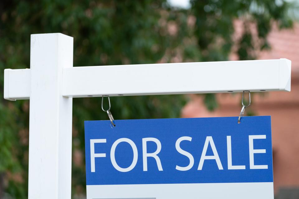 A For Sale sign is posted outside a home in Glendale, Ariz. on Feb. 26, 2024.