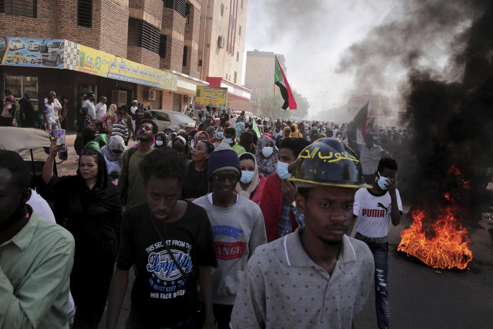 People chant slogans during a protest to denounce the October 2021 military coup, in Khartoum, Sudan, Thursday, Jan. 6, 2022. Sudanese took to the streets in the capital, Khartoum, and other cities on Thursday in anti-coup protests as the country plunged further into turmoil following the resignation of the prime minister earlier this week. (AP Photo/Marwan Ali)