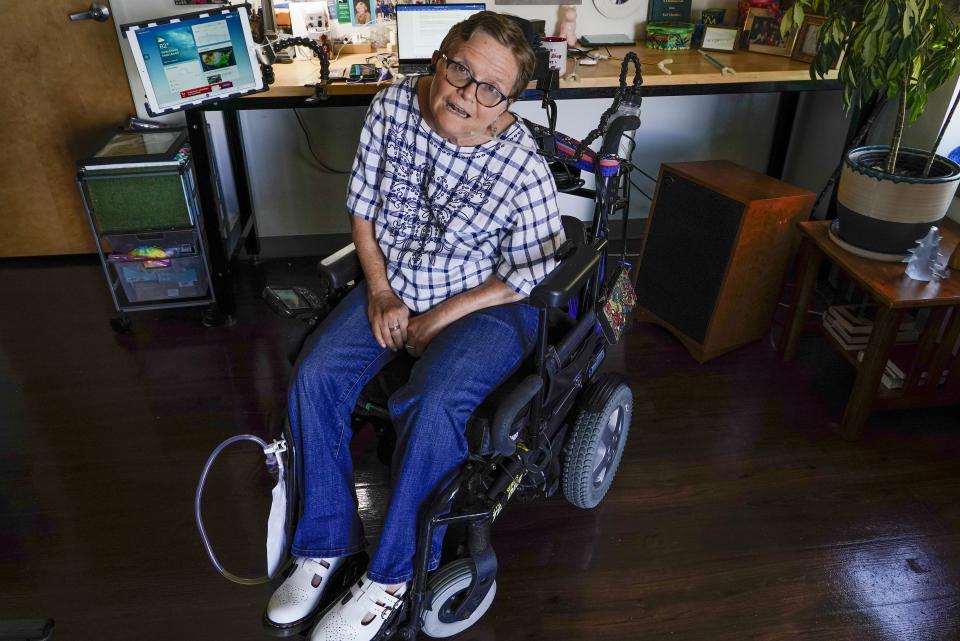 Martha Chambers pose in her apartment Friday, Sept. 2, 2022, in Milwaukee. Wisconsin voters with disabilities are celebrating a win after a federal judge, citing the Voting Rights Act, ruled that they may get assistance returning their ballots. (AP Photo/Morry Gash)