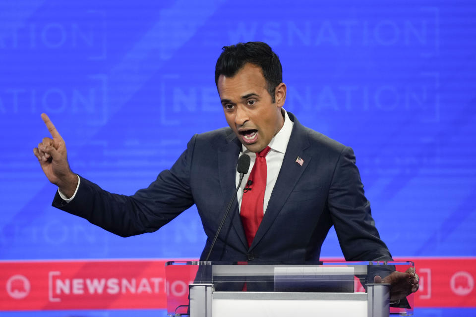 Republican presidential candidate businessman Vivek Ramaswamy gesturing during an exchange with former New Jersey Gov. Chris Christie during a Republican presidential primary debate hosted by NewsNation on Wednesday, Dec. 6, 2023, at the Moody Music Hall at the University of Alabama in Tuscaloosa, Ala. (AP Photo/Gerald Herbert)