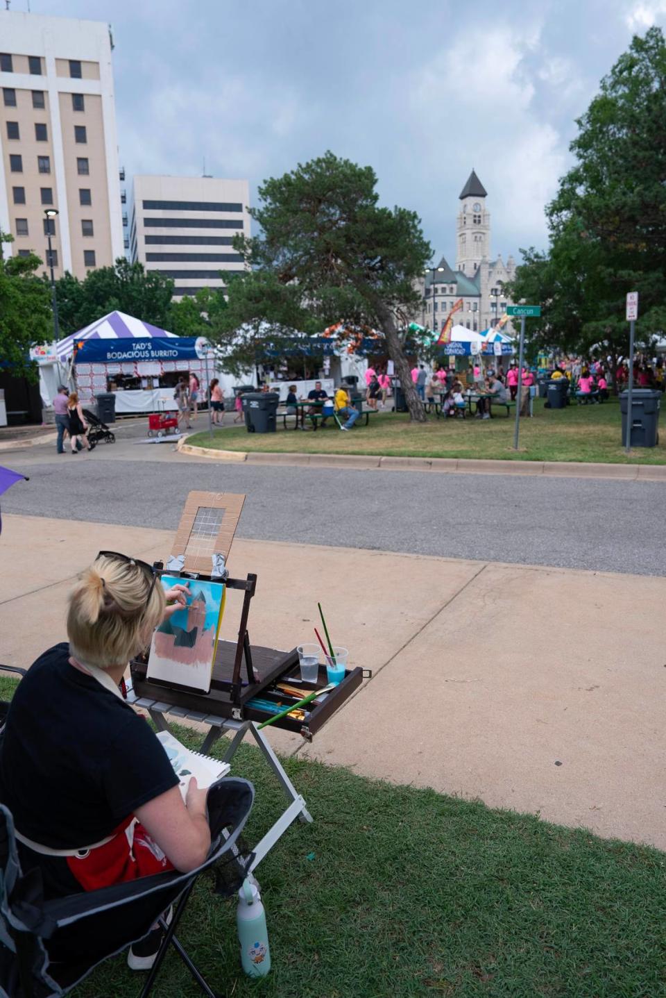 Makayla Troyer paints the Sedgwick County Historical Museum during the Wichita Riverfest’s Plein Air event.