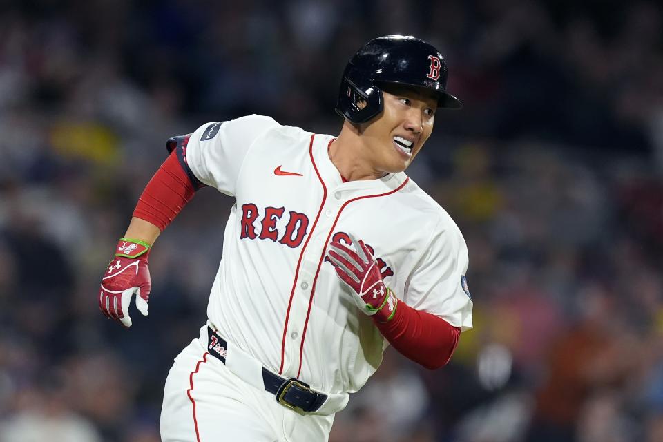 Boston Red Sox's Masataka Yoshida runs on his single during the third inning of a baseball game against the Chicago Cubs, Sunday, April 28, 2024, in Boston. (AP Photo/Michael Dwyer)