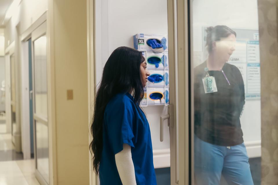 Bartlett High senior Eliza Sawyer talks with a patient with nurse Alicia Whiteaker in the Emergency Room as part of a partnership with St. Francis-Bartlett, where seniors shadow professionals at the hospital, on Tuesday, Feb. 27, 2024 in Bartlett, Tenn.