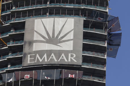 FILE PHOTO: A logo of Dubai's Emaar Properties is seen at an under-construction building in Dubai, UAE March 3, 2016. REUTERS/Ahmed Jadallah/File Photo