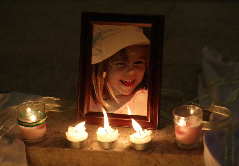 Candles are placed next to a photo of Madeleine McCann inside the Church of Nossa Senhora da Luz in Praia Da Luz, Portugal, where a special service was held to mark the 10th anniversary of her disappearance.