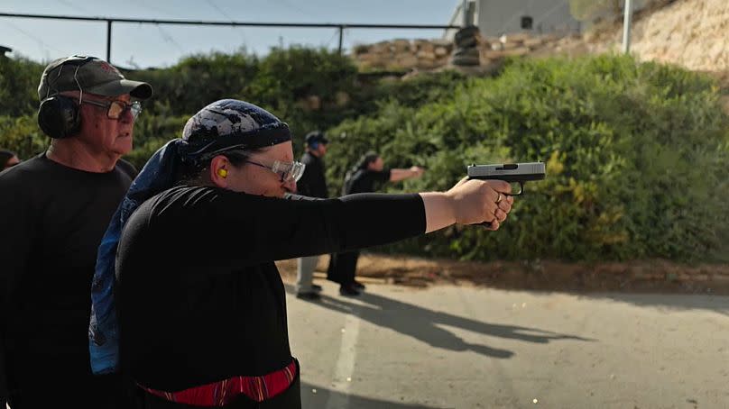 Kalanit, an Emergency Medical Technician practices at a shooting range near Beitar Illit