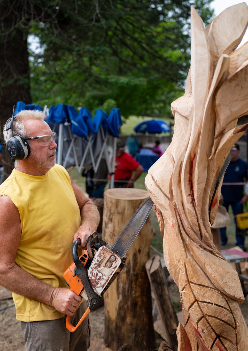 Gary Keenan carves a statue at the Iowa State Fair on Aug. 15.
