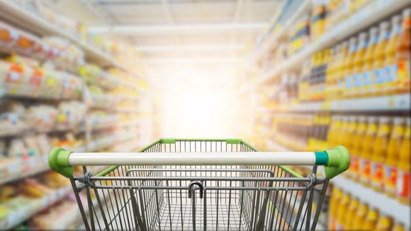 Shopping cart in a store aisle.