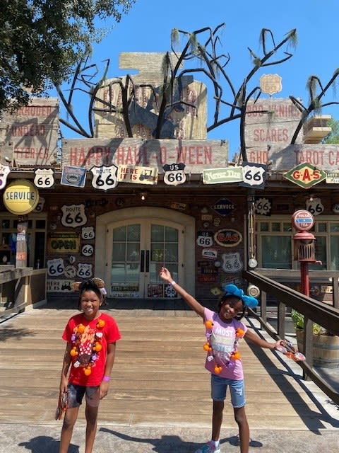 the author's daughters in front of the cars-themed motel