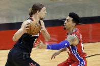 Houston Rockets forward Kelly Olynyk, left, looks to drive around Philadelphia 76ers forward Danny Green, right, during the first half of an NBA basketball game Wednesday, May 5, 2021, in Houston. (AP Photo/Michael Wyke, Pool)