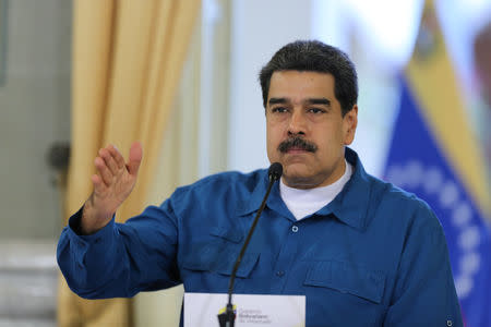 Venezuela's President Nicolas Maduro gestures while he speaks during a meeting with members of the government in Caracas, Venezuela, February 13, 2019. Miraflores Palace/Handout via REUTERS