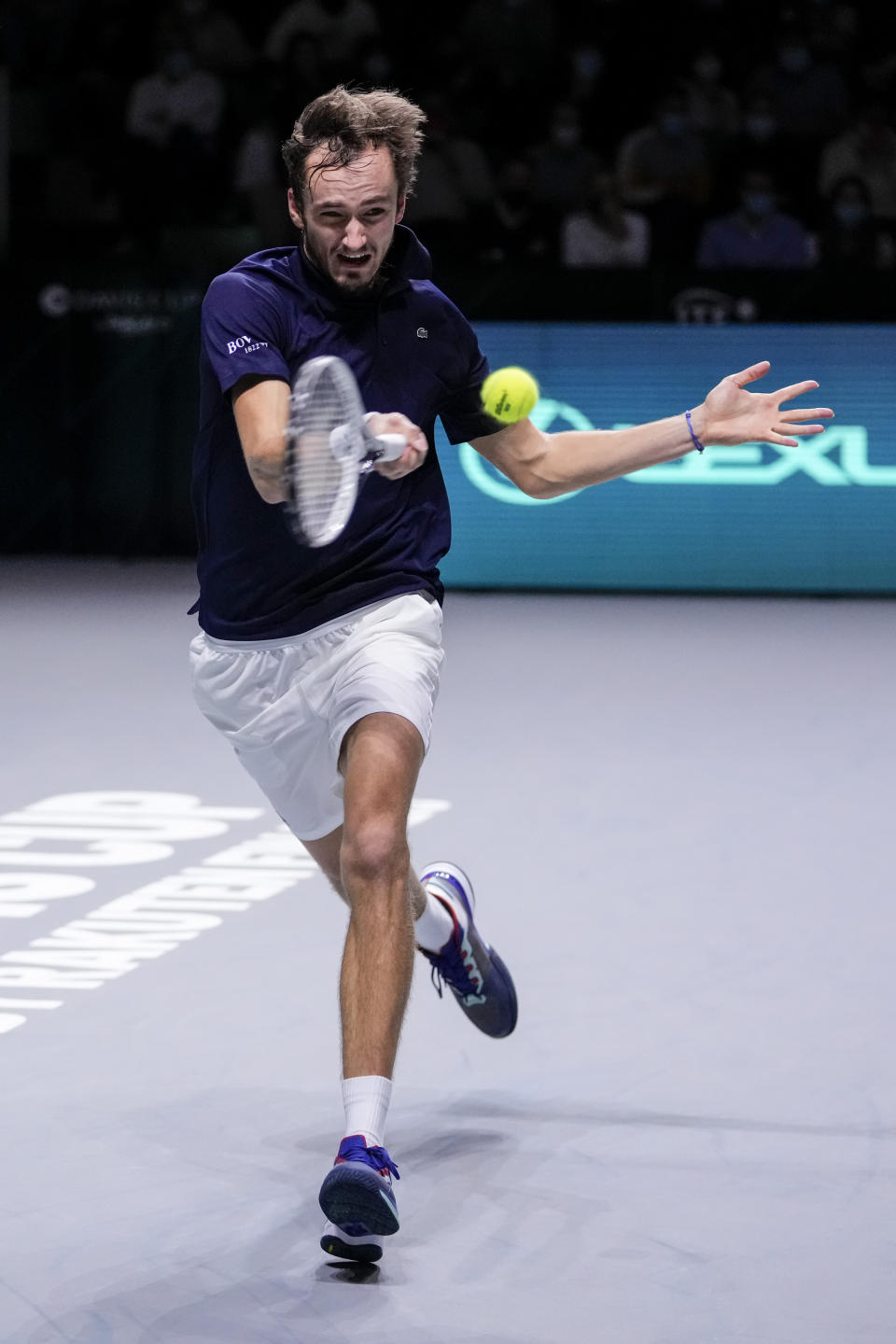 Russian Tennis Federation's Daniil Medvedev returns the ball to Croatia's Marin Cilic during their Davis Cup tennis finals at Madrid Arena in Madrid, Spain, Sunday, Dec. 5, 2021. (AP Photo/Manu Fernandez)