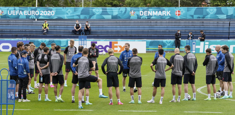 Denmark's manager Kasper Hjulmand, center, talks to his team at the training ground during a training session of Denmark's national team in Helsingor, Denmark, Monday, June 14, 2021. It is the first training of the Danish team since the Euro championship soccer match against Finland when Christian Eriksen collapsed last Saturday. (AP Photo/Martin Meissner)