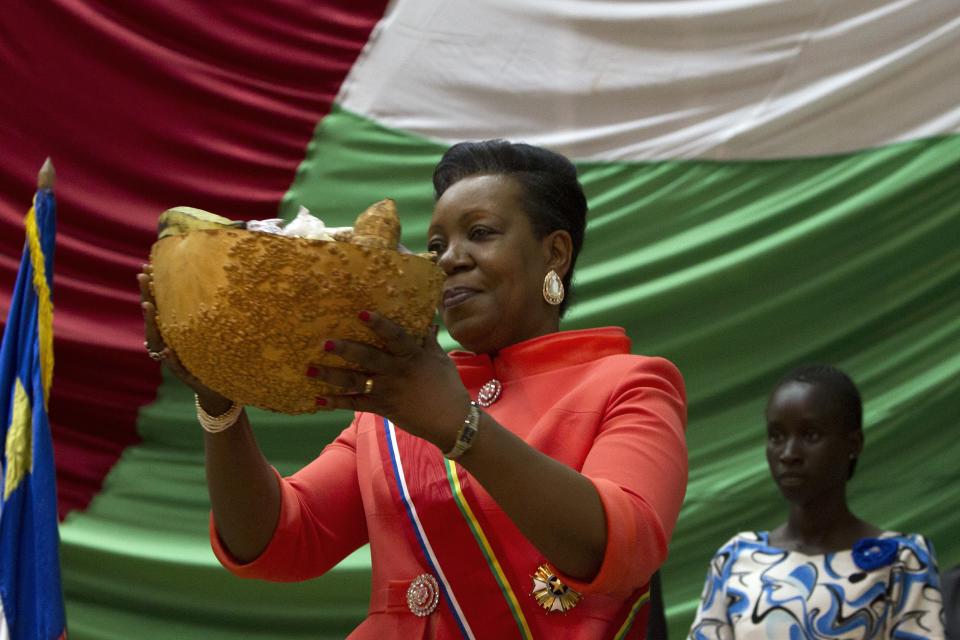 New parliamentary-elected interim President of the Central African Republic Samba-Panza receives a gift as part of local tradition during her swearing-in ceremony at the National Assembly in the capital Bangui