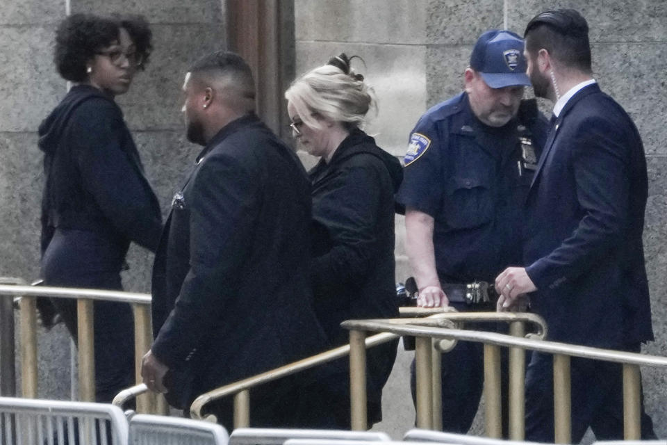Stormy Daniels, center, exits the courthouse at Manhattan criminal court in New York, Tuesday, May 7, 2024. The porn actor, whose real name is Stephanie Clifford, took the stand mid-morning Tuesday and testified about her alleged sexual encounter with former President Donald Trump in 2006. (AP Photo/Seth Wenig)