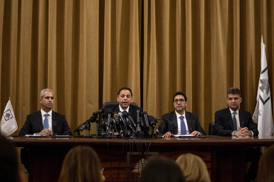 Incoming interim governor Wassim Mansouri, second left, speaks during a press conference with other vice governors at the Lebanese Central Bank building, in Beirut, Lebanon, Monday, July 31, 2023. Lebanon's embattled central bank governor Riad Salameh, 73, stepped down Monday under a cloud of investigation and blame for his country's economic crisis as several European countries probe him for alleged financial crimes. (AP Photo/Hassan Ammar)