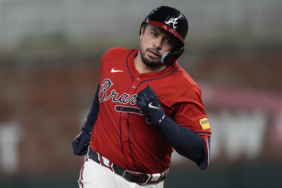 Atlanta Braves' Travis d'Arnaud runs the bases after hitting a grand slam in the sixth inning of a baseball game against the Texas Rangers Friday, April 19, 2024, in Atlanta.The home run was d'Arnaud's third of the game. (AP Photo/John Bazemore)