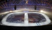 A map of Australia is projected onto the stadium floor as athletes march in during the opening ceremony of the 2014 Sochi Winter Olympics, February 7, 2014. REUTERS/Pawel Kopczynski