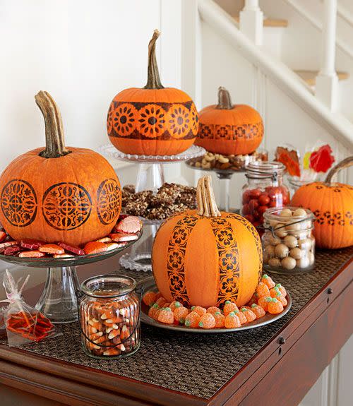 <p>A candy buffet gets some Halloween spirit, thanks to no-carve pumpkins. To create the patterns, tape on multiple store-bought stencils (simple graphic designs work best), brush over them with black acrylic paint and you're done.</p><p><a class="link " href="https://www.amazon.com/CrafTreat-Flourish-Background-Stencil-x6/dp/B0756F1TQK/ref=sr_1_1_sspa?tag=syn-yahoo-20&ascsubtag=%5Bartid%7C10055.g.1714%5Bsrc%7Cyahoo-us" rel="nofollow noopener" target="_blank" data-ylk="slk:SHOP STENCILS;elm:context_link;itc:0;sec:content-canvas">SHOP STENCILS</a><br></p><p><em><a href="https://www.goodhousekeeping.com/holidays/halloween-ideas/a23920/stamp-pumpkins/" rel="nofollow noopener" target="_blank" data-ylk="slk:Get the tutorial »;elm:context_link;itc:0;sec:content-canvas" class="link ">Get the tutorial »</a></em></p>