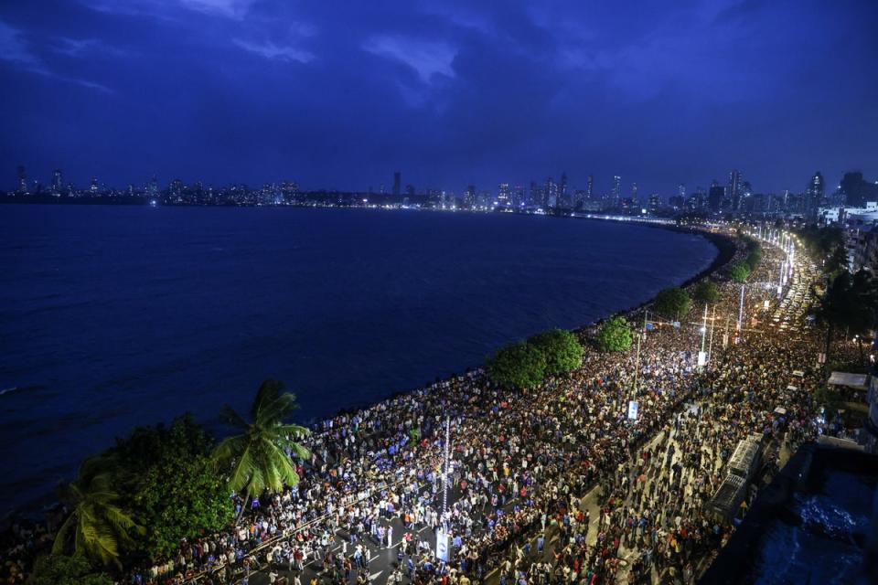 Fans gather at Marine Drive ahead of the Indian cricket team’s victory parade in Mumbai (EPA)