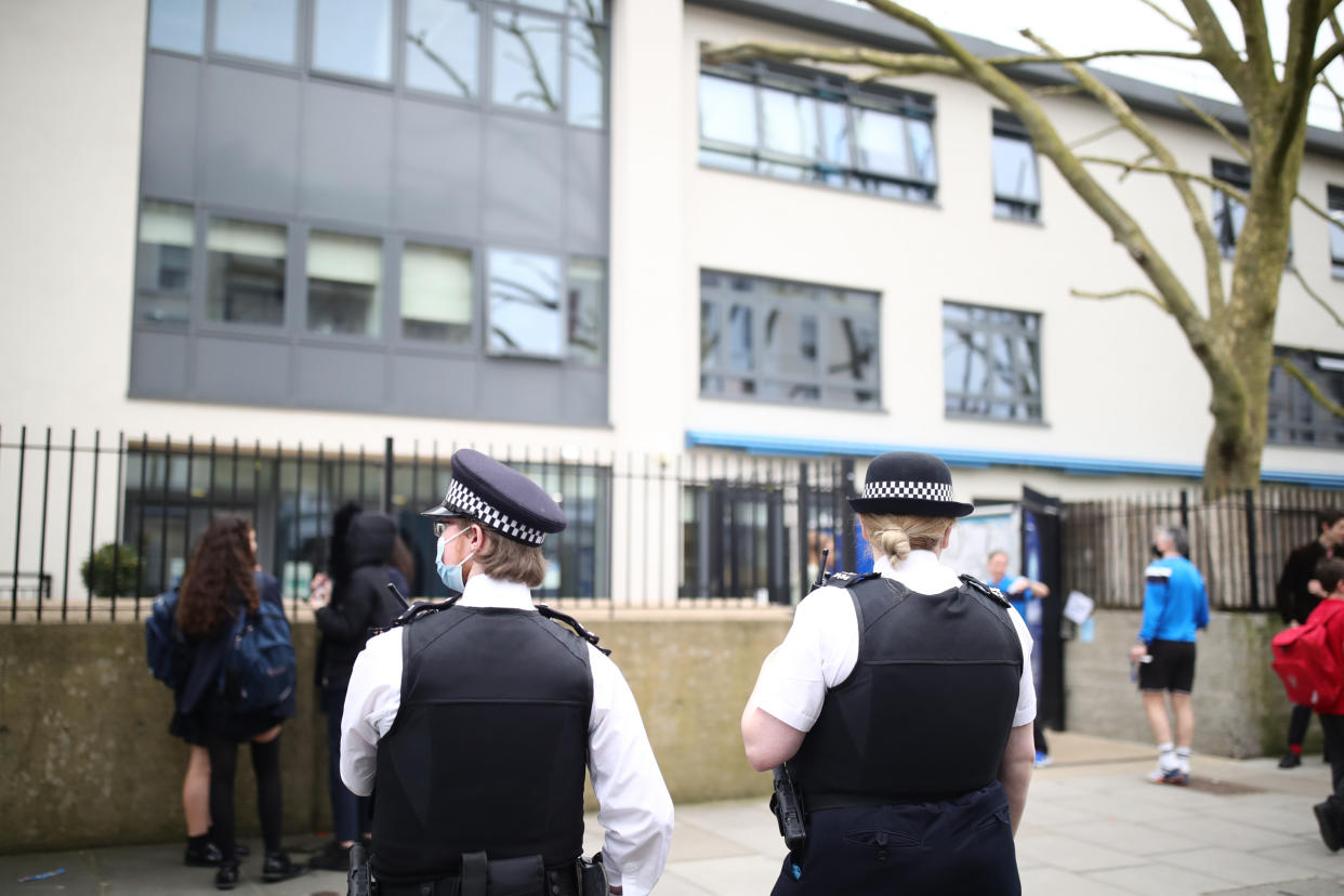 Police officers outside Pimlico Academy School, west London, where students have staged a walkout in protest over a school uniform policy that they claim is discriminatory and racist. Picture date: Wednesday March 31, 2021. (Photo by Aaron Chown/PA Images via Getty Images)