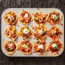 <p>Layer beef and cheese on crunchy wonton wrappers, bake until bubbly, then top with salsa and sour cream. It's a one-bite party! </p><p><em><a href="https://www.goodhousekeeping.com/food-recipes/a35191674/taco-cups-recipe/" rel="nofollow noopener" target="_blank" data-ylk="slk:Get the recipe for Taco Cups »;elm:context_link;itc:0;sec:content-canvas" class="link ">Get the recipe for Taco Cups »</a></em></p>