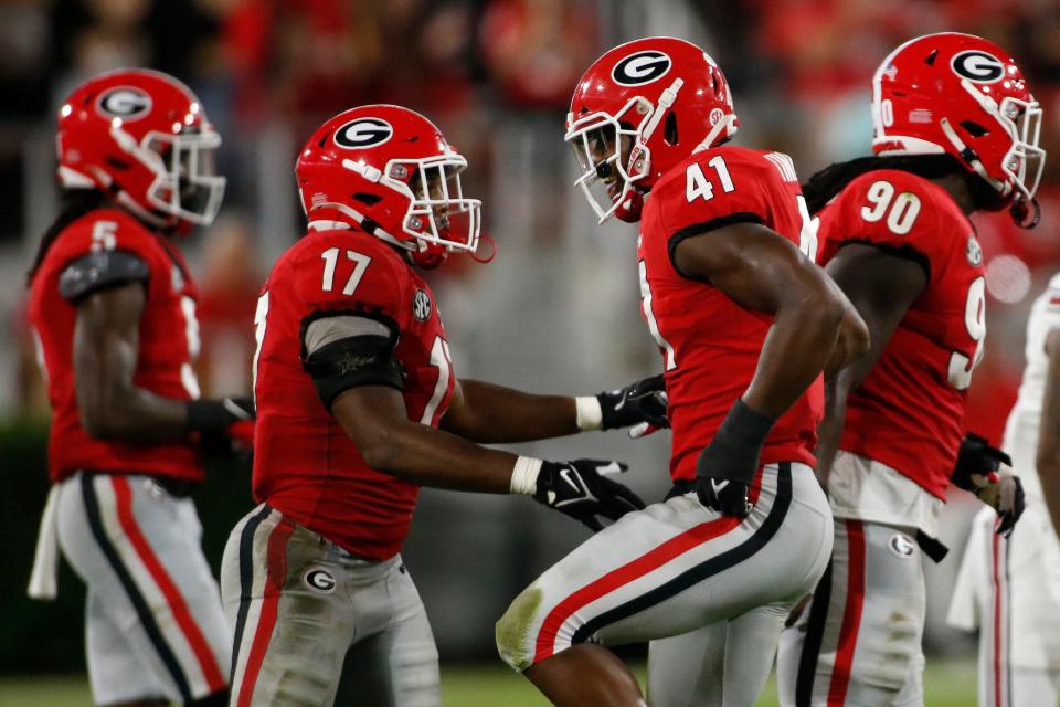 Sep 18, 2021; Athens, Georgia, USA; Georgia inside linebacker Channing Tindall (41) celebrates after getting a sack during the second half of an NCAA college football game between South Carolina and Georgia at Sanford Stadium. Joshua L. Jones/Athens Banner-Herald via USA TODAY NETWORK