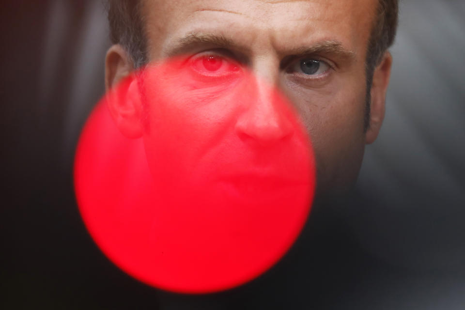 FILE - In this Oct.1, 2020 file photo, French President Emmanuel Macron speaks on camera as he arrives for an EU summit at the European Council building in Brussels. With a year to go to the presidential vote, French President Emmanuel Macron is getting ready for a potential re-election bid by prioritizing reviving the economy and saving jobs. The country is slowly stepping out of its partial lockdown. Macron’s ability to meet the challenge will be key _ as France is among countries worst hit by the pandemic in the world, with over 105,000 virus-related deaths. (AP Photo/Francisco Seco, Pool, File)