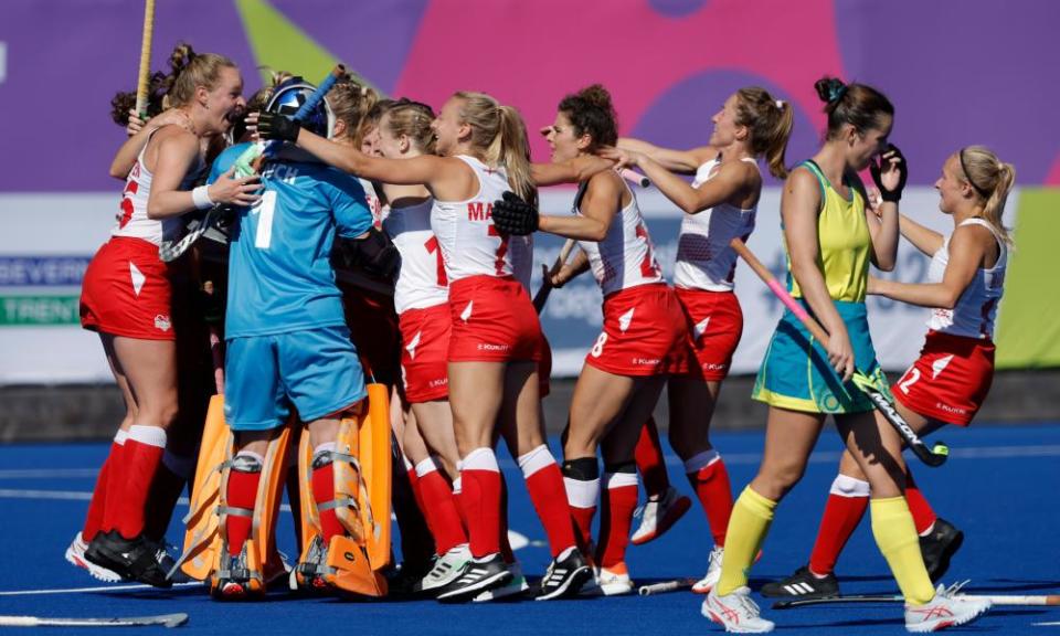 England’s players celebrate their gold at the finial whistle.