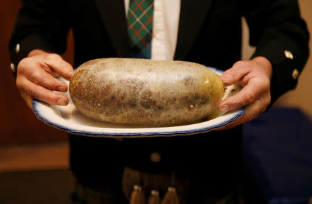 FILE PHOTO: A Haggis is carried at a Burns supper in Killiecrankie, Scotland January 25, 2014. REUTERS/Russell Cheyne/File Photo