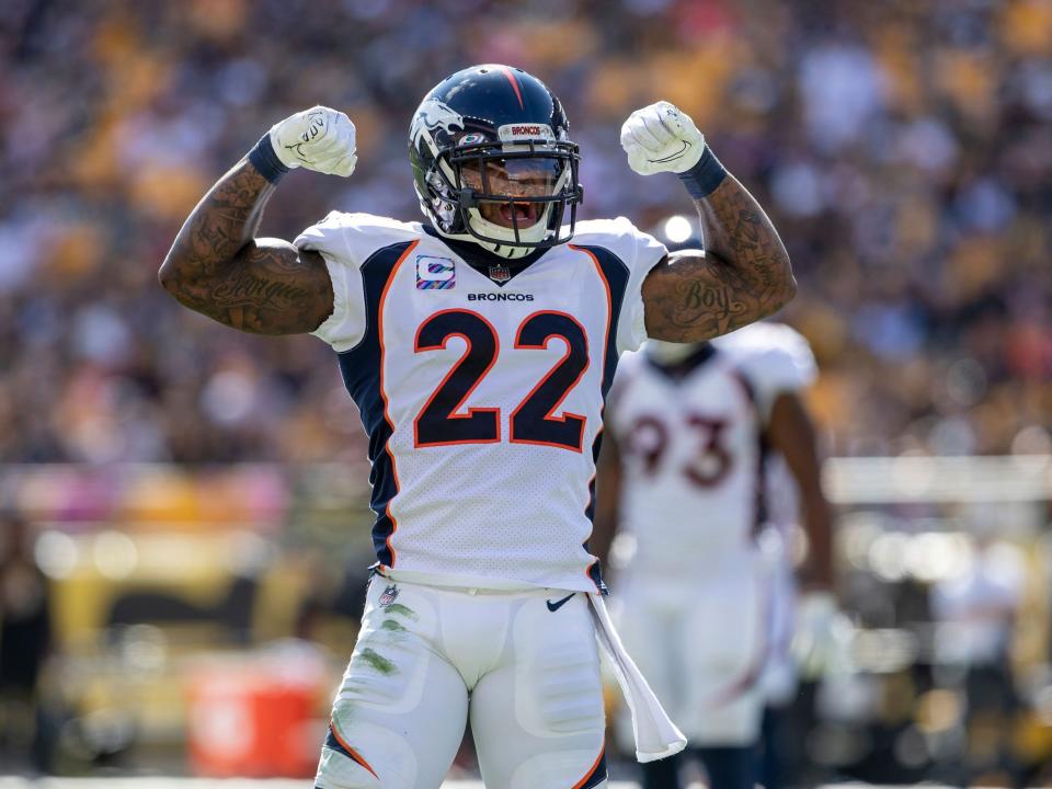 Kareem Jackson celebrates a tackle in a game against the Pittsburgh Steelers.