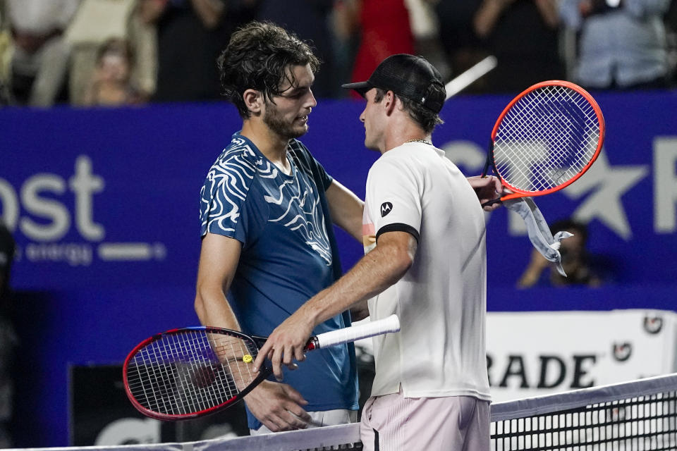 Tommy Paul of the United States, right, is congratulated by Taylor Fritz of the United States after Paul won a semifinal match at the Mexican Open tennis tournament in Acapulco, Mexico, Friday, March 3, 2023. (AP Photo/Eduardo Verdugo)