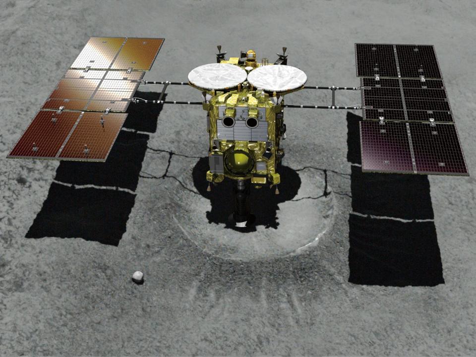 FILE - This computer graphic image provided by the Japan Aerospace Exploration Agency (JAXA) shows the Japanese unmanned spacecraft Hayabusa2 approaching on the asteroid Ryugu. Hayabusa2 is approaching the surface of an asteroid about 280 million kilometers (170 million miles) from Earth. The JAXA said Thursday, Feb. 21, 2019 that Hayabusa2 began its approach at 1:15 p.m.  (JAXA via AP, File)