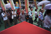 <p>Protesters hold banners during a march to mark May Day in Hong Kong May 1, 2018. Hundreds of Hong Kong workers from various labor unions staged a rally to demand better workers’ rights and call for standard working hours. (Photo: Vincent Yu/AP) </p>