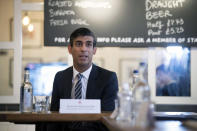 Britain's Chancellor of the Exchequer Rishi Sunak hosts a roundtable discussion for business representatives at Franco Manca restaurant in London, Thursday Oct. 22, 2020. The Chancellor is set to announce a new support package for businesses affected by coronavirus restrictions. (Stefan Rousseau/PA via AP)
