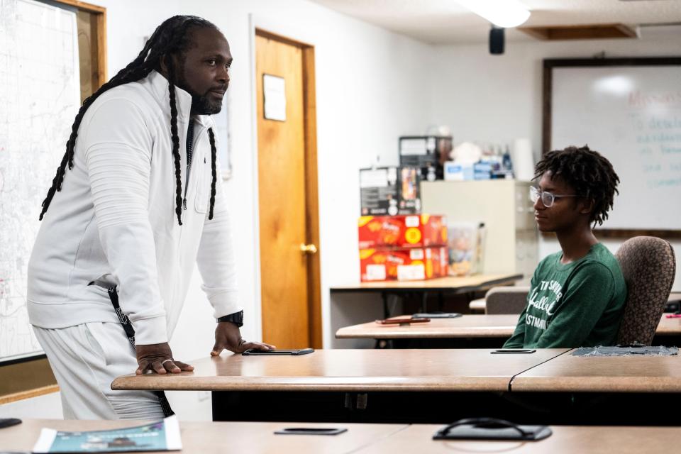 Tim McCoy talks with teenagers during after school programming at Creative Visions on Nov. 29, 2023, in Des Moines.