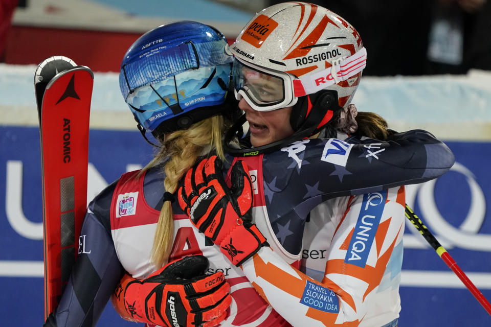 Slovakia's Petra Vlhova, right, hugs second placed United States' Mikaela Shiffrin after winning an alpine ski, women's World Cup slalom in Flachau, Austria, Tuesday, Jan.10, 2023. (AP Photo/Giovanni Auletta)