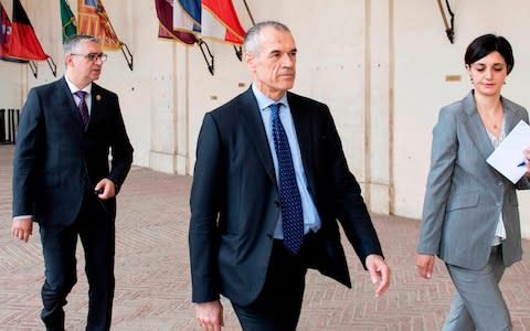 Carlo Cottarelli, 64, an economist formerly with the International Monetary Fund, arrives for a meeting with Italian President Sergio Mattarella at the Quirinale palace in Rome - Credit:  AFP