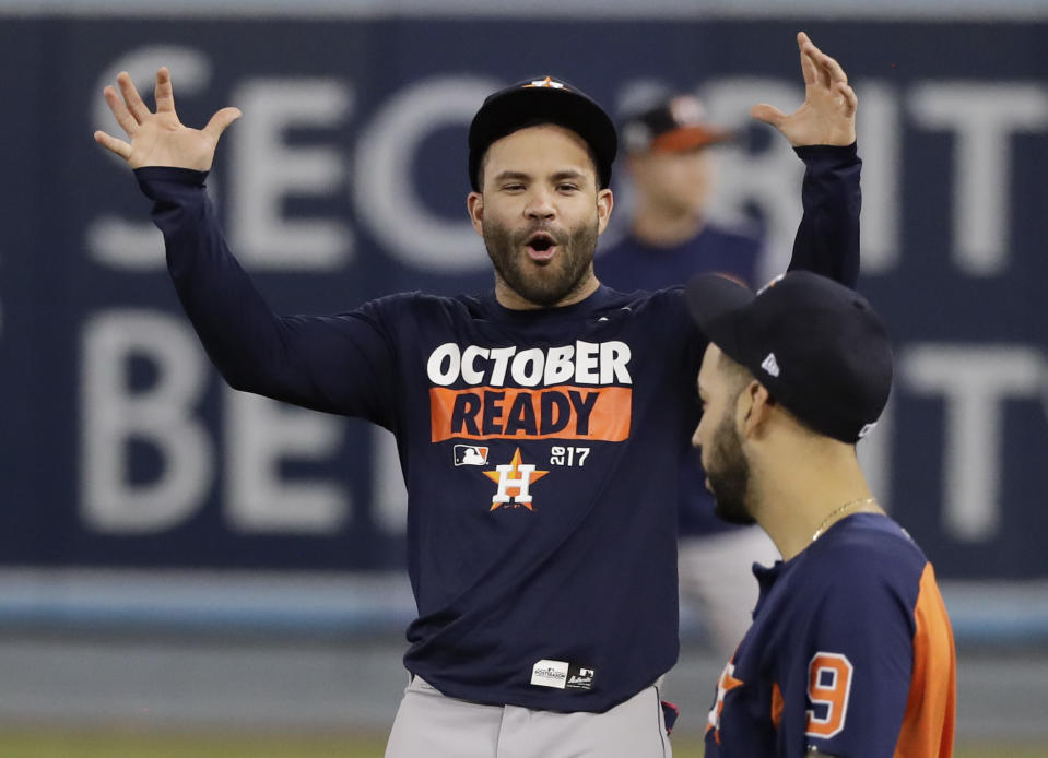 Houston Astros second baseman Jose Altuve, left, talks with left fielder Marwin Gonzalez during batting practice on Oct. 23, 2017. (AP)