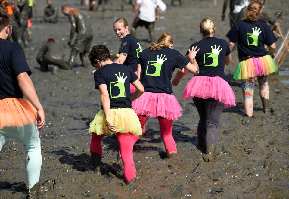 <p>Participants arrive at the pitch before their handball match at the so called “Wattoluempiade” (Mud Olympics) in Brunsbuettel at the North Sea, Germany July 30, 2016. (REUTERS/Fabian Bimmer) </p>