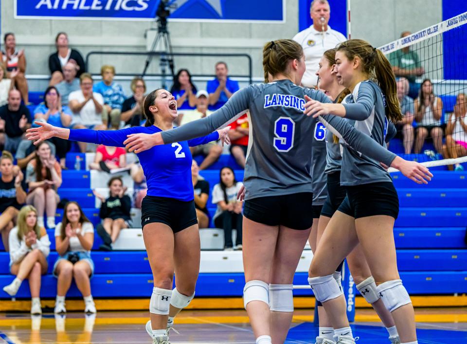 LCC's Macey Beyerlein (2) celebrates after the Stars increased their lead in the third and decisive set of their match with Muskegon Community College on Sept. 5.