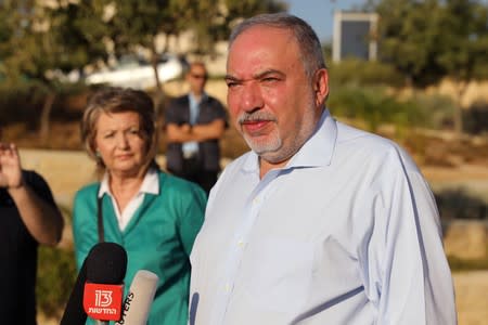 Avigdor Lieberman, leader of Yisrael Beitenu party, speaks to members of the media after casting his ballot in Israel's parliamentary election, at a polling station in the Israeli settlement of Nokdim in the occupied West Bank
